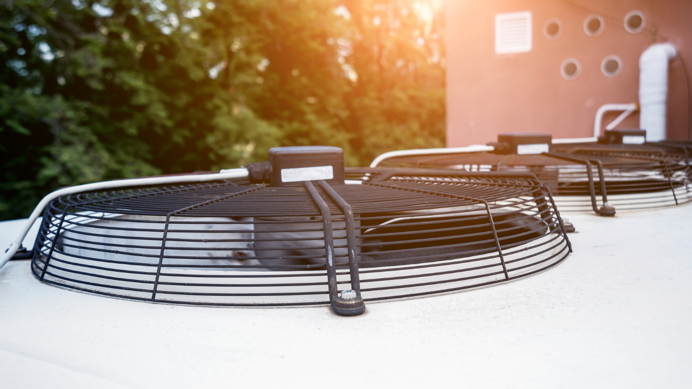 A row of grills sitting on top of a white car