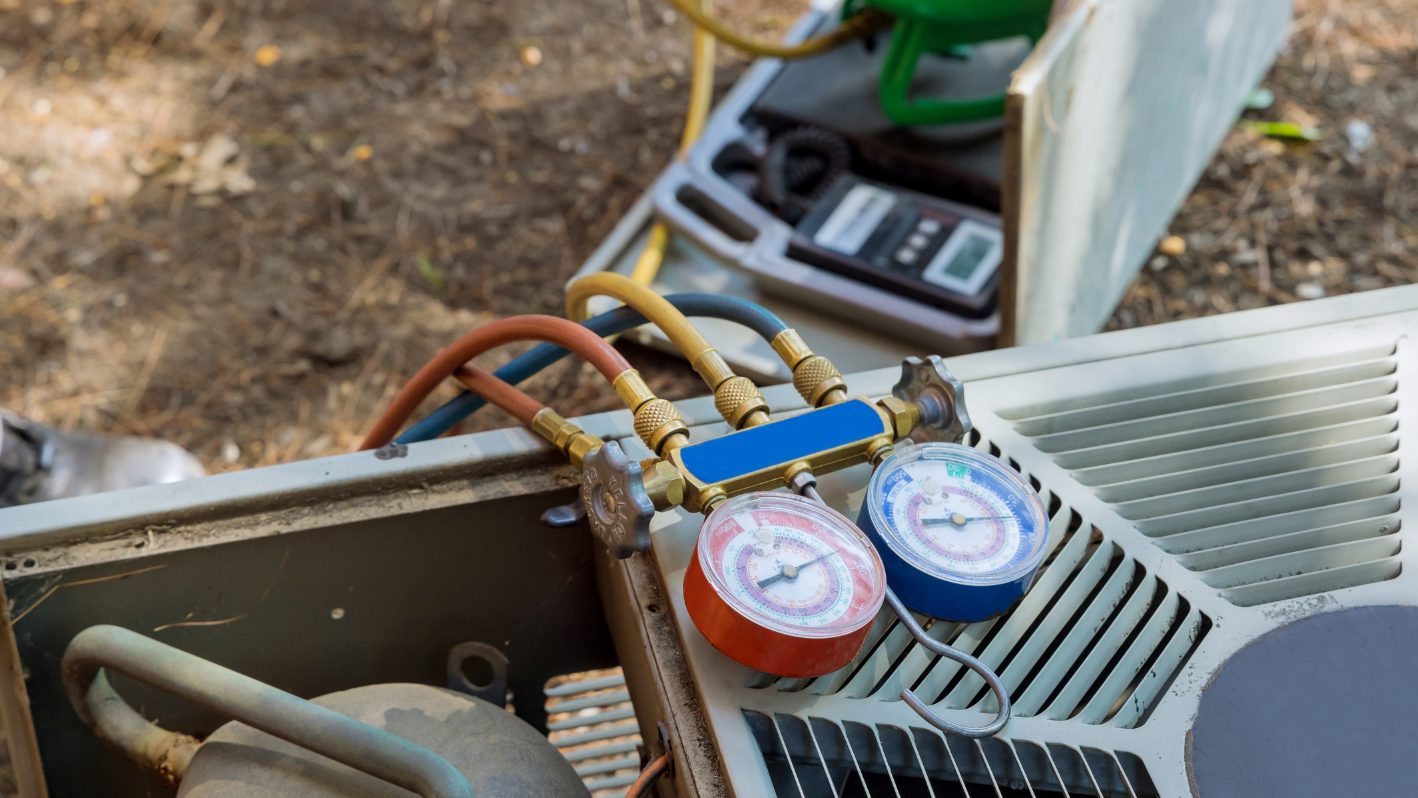 A couple of gauges are on top of a heater